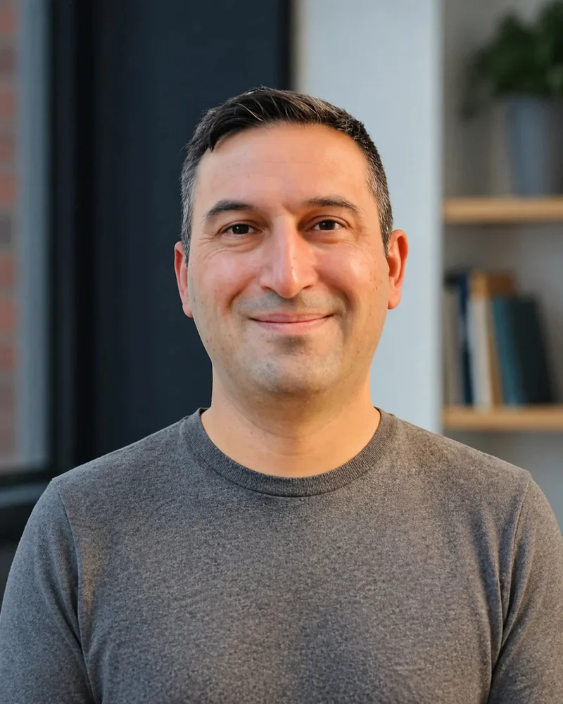 Portrait used to illustrate founder-led infrastructure review in a quiet office setting.