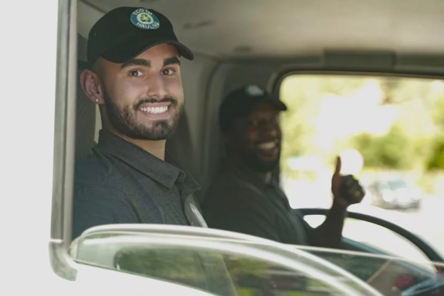 An Eco 1st team member in the hauling truck