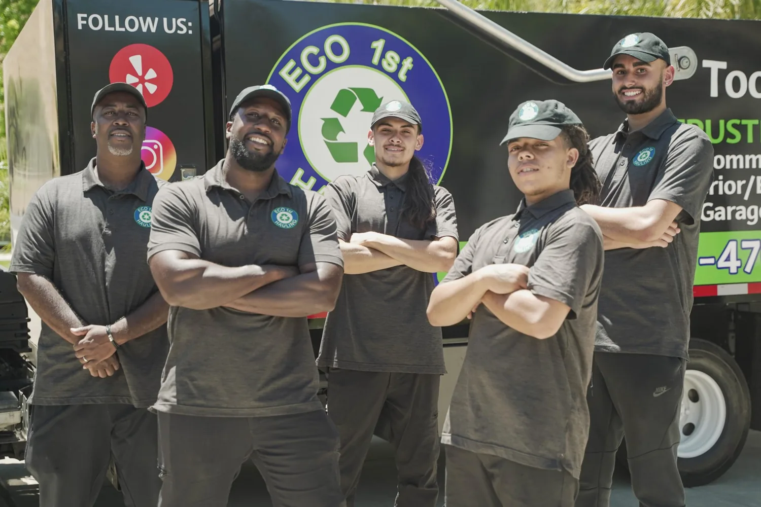 Eco 1st Hauling crew together beside their truck