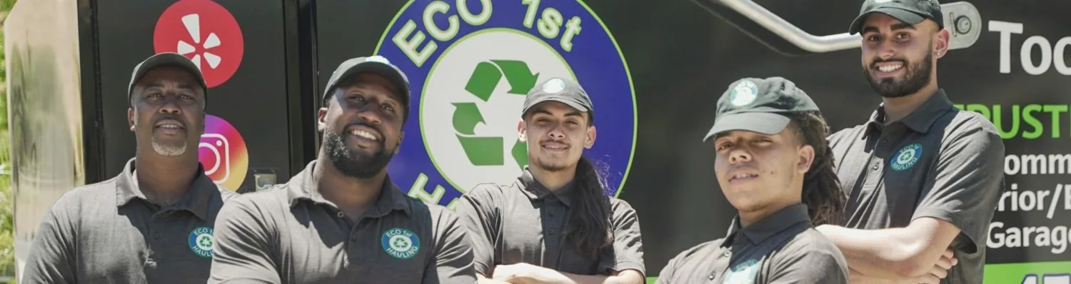 Eco 1st Hauling crew beside their branded truck