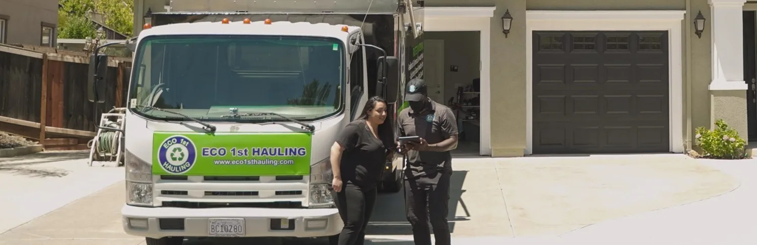 Eco 1st team beside their branded hauling truck