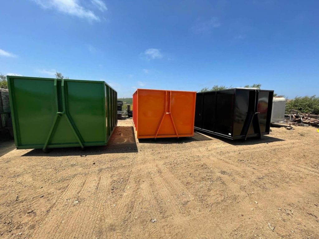 The business’s green, orange and black containers