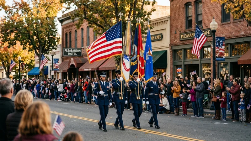 Military color guard carrying American flags along tree-lined Main Street in downtown Pleasanton under autumn sunlight