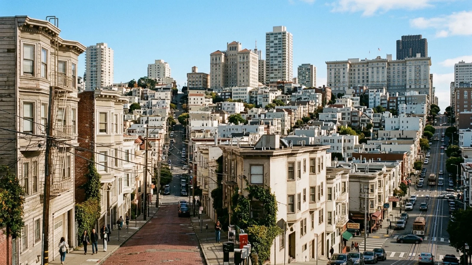 Daytime view of San Francisco’s Nob Hill and North Beach residential towers and historic brick alleyways under autumn sunshine