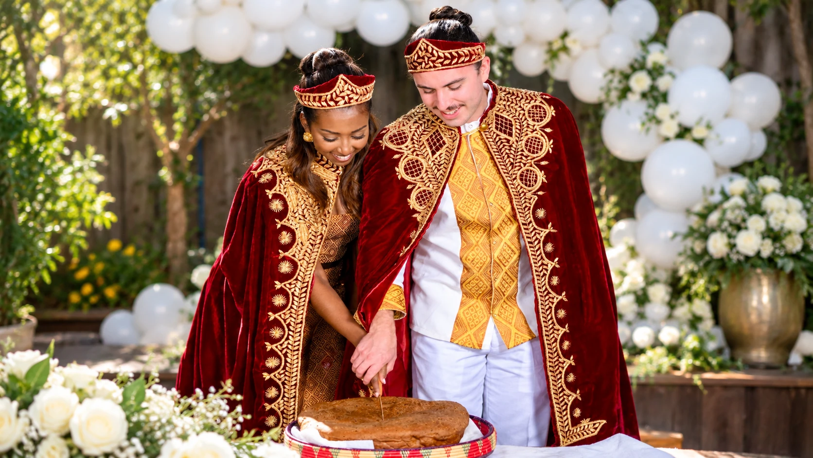 Mekaleya Tilahun and Raumin Neuville take part in a ceremonial bread cutting during their Ethiopian wedding celebration in San Ramon on October 11, 2026