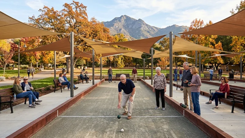 Neighbors and seniors playing bocce ball on resurfaced crushed oyster-shell courts beneath tan architectural shade sails at Livorna Park in Alamo