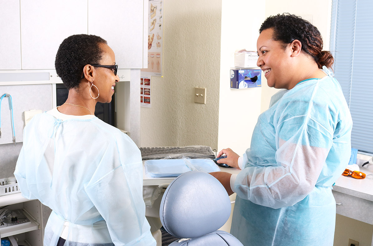 Dr. Amare sharing a smile with a patient